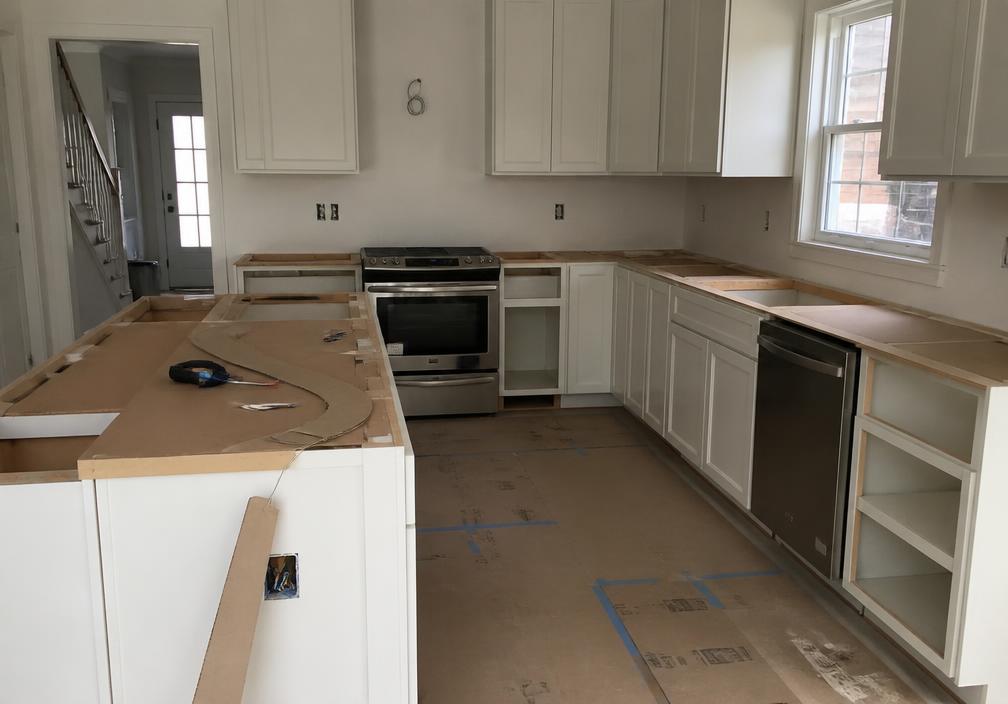 Remodeled kitchen with new cabinets, countertops, and island